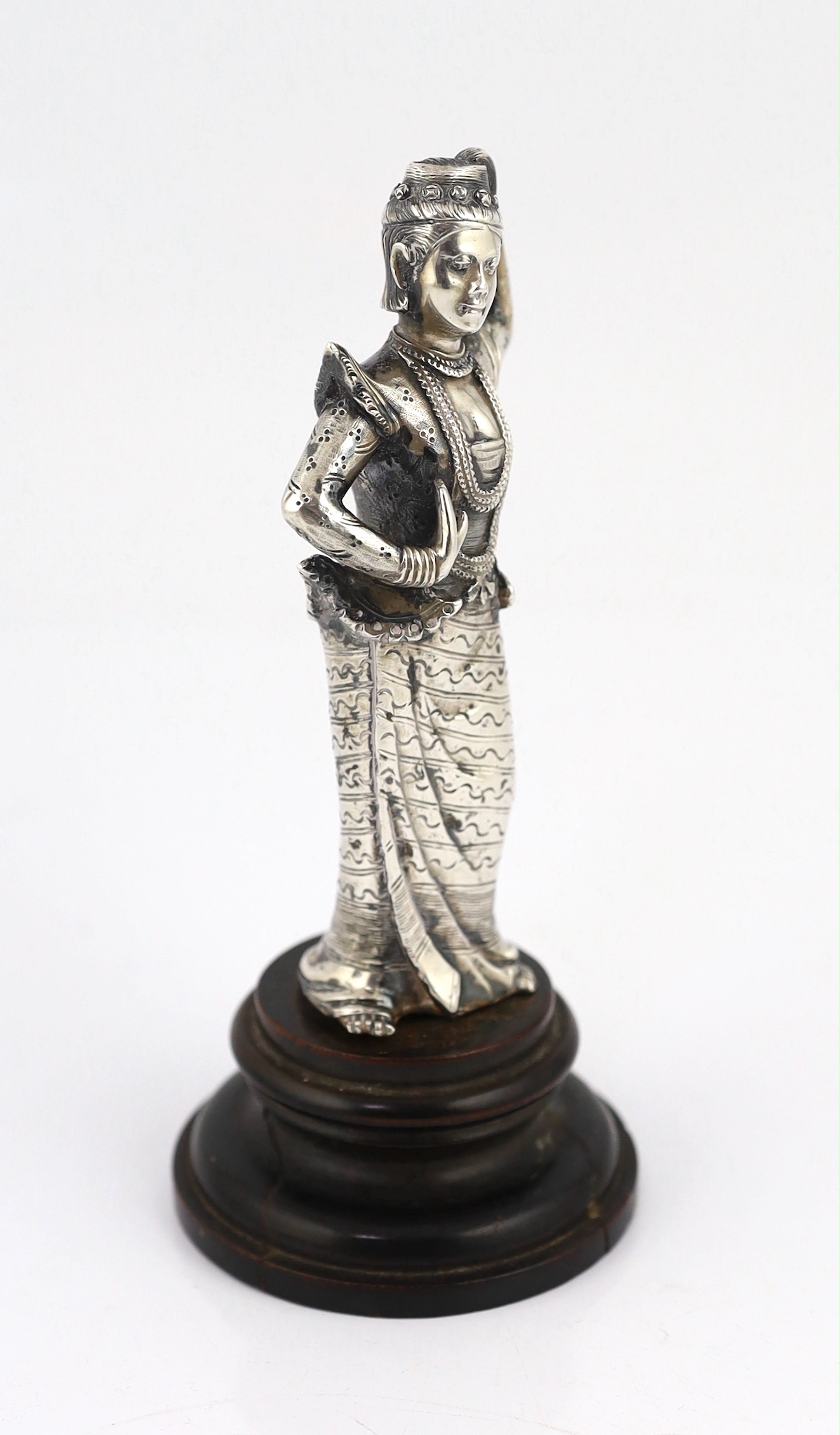 A Burmese cast silver model of a dancer, late 19th century